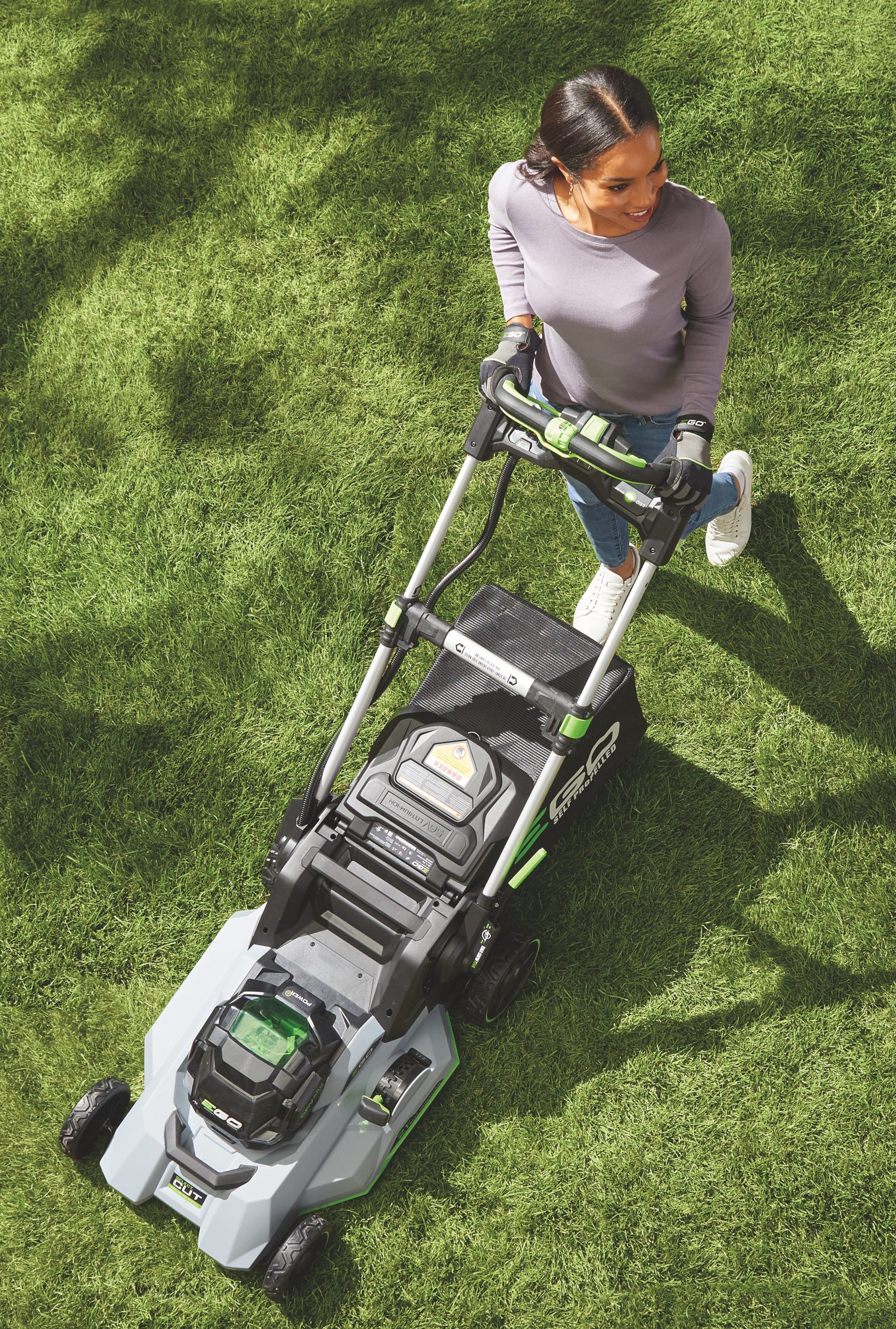 Woman mowing her lawn.